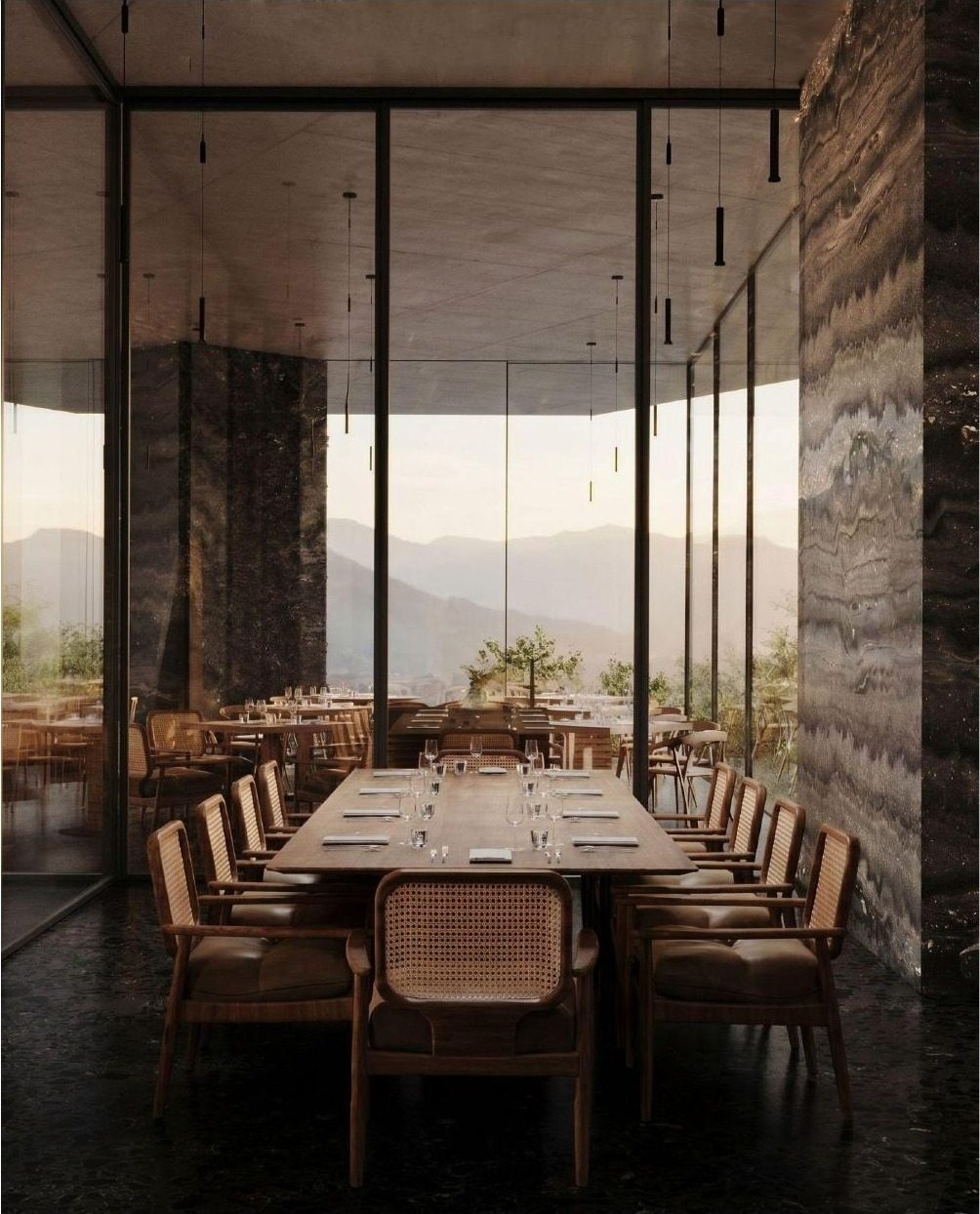 Private dining room with long table and glass wall to the mountains