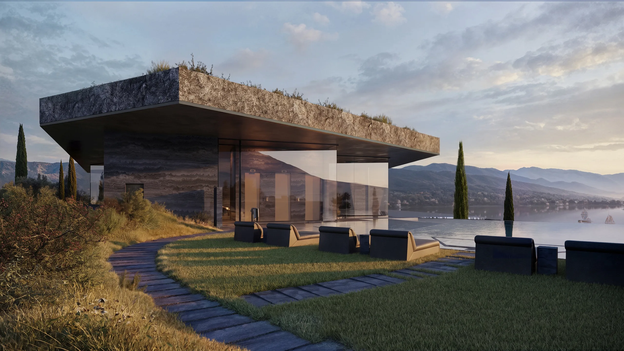 A residence on the slope, its stone roof reaching over the terrace, cypresses beyond.
